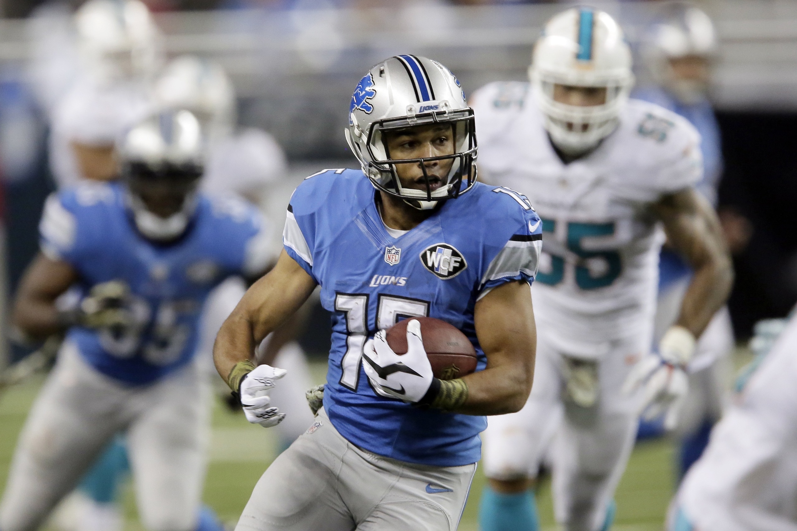 Detroit Lions wide receiver Golden Tate (15) runs during the second half of an NFL football game against the Miami Dolphins in Detroit, Sunday, Nov. 9, 2014. (AP Photo/Duane Burleson) Detroit Lions wide receiver Golden Tate (15) runs during the second half of an NFL football game against the Miami Dolphins in Detroit, Sunday, Nov. 9, 2014. (AP Photo/Duane Burleson)