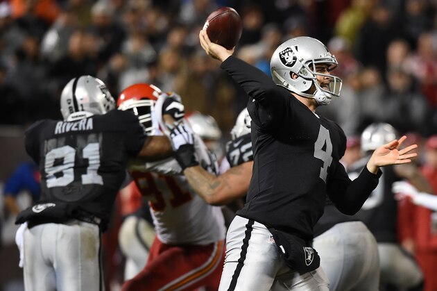 OAKLAND, CA - NOVEMBER 20:  Derek Carr #4 of the Oakland Raiders passes the ball during the game against the Kansas City Chiefs at O.co Coliseum on November 20, 2014 in Oakland, California.  (Photo by Thearon W. Henderson/Getty Images)