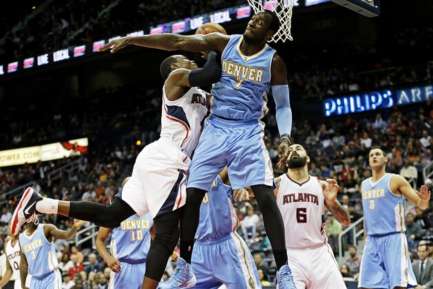 Atlanta Hawks' Paul Millsap, left, goes up for a shot against Denver Nuggets' J.J. Hickson in the first quarter of an NBA basketball game, Sunday, Dec. 7, 2014, in Atlanta. (AP Photo/David Goldman) Atlanta Hawks' Paul Millsap, left, goes up for a shot against Denver Nuggets' J.J. Hickson in the first quarter of an NBA basketball game, Sunday, Dec. 7, 2014, in Atlanta. (AP Photo/David Goldman)