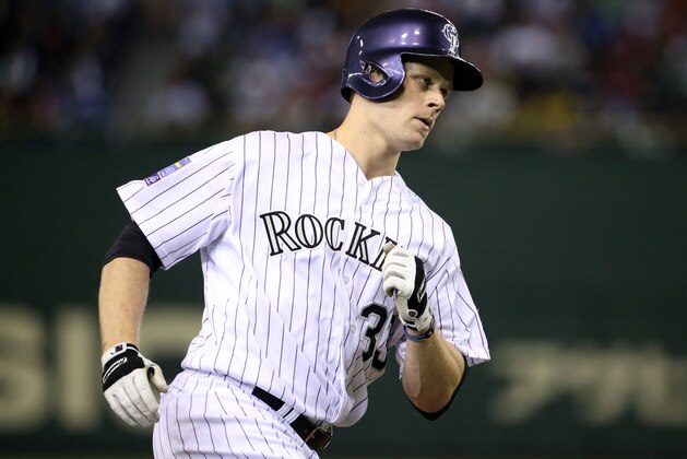 TOKYO, JAPAN - NOVEMBER 16:  Justin Morneau #33 of the Colorado Rockies heads home after hitting a three-run homer  in the third inning during the game four of Samurai Japan and MLB All Stars at Tokyo Dome on November 16, 2014 in Tokyo, Japan.  (Photo by Atsushi Tomura/Getty Images)