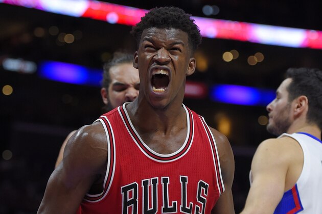 Chicago Bulls guard Jimmy Butler, left, reacts after scoring as Los Angeles Clippers guard J.J. Redick looks on during the second half of an NBA basketball game, Monday, Nov. 17, 2014, in Los Angeles.   The Bulls won 105-89. (AP Photo/Mark J. Terrill)