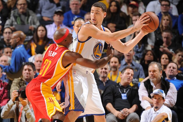 OAKLAND, CA - DECEMBER 10: Klay Thompson #11 of the Golden State Warriors handles the ball against Jason Terry #31 of the Houston Rockets on December 10, 2014 at Oracle Arena in Oakland, California. NOTE TO USER: User expressly acknowledges and agrees that, by downloading and or using this photograph, user is consenting to the terms and conditions of Getty Images License Agreement. Mandatory Copyright Notice: Copyright 2014 NBAE (Photo by Noah Graham/NBAE via Getty Images)