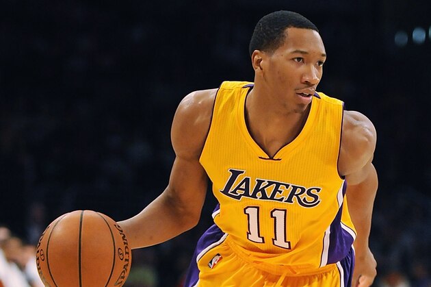 LOS ANGELES, CA - DECEMBER 09:  Wesley Johnson #11 of the Los Angeles Lakers moves the ball up the court during a game against the Sacramento Kings at Staples Center on December 9, 2014 in Los Angeles, California.   NOTE TO USER: User expressly acknowledges and agrees that, by downloading and or using this photograph, User is consenting to the terms and conditions of the Getty Images License Agreement.  (Photo by Jonathan Moore/Getty Images)