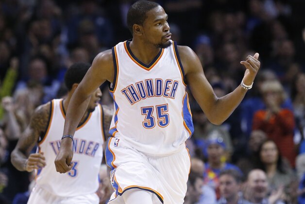 Oklahoma City Thunder forward Kevin Durant (35) gestures as he runs up the court in the second quarter of an NBA basketball game against the Milwaukee Bucks in Oklahoma City, Tuesday, Dec. 9, 2014. (AP Photo/Sue Ogrocki)