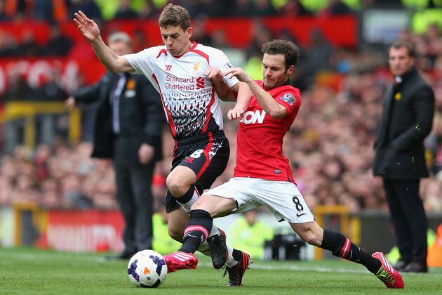 MANCHESTER, ENGLAND - MARCH 16:  Jon Flanagan of Liverpool competes with Juan Mata of Manchester United during the Barclays Premier League match between Manchester United and Liverpool at Old Trafford on March 16, 2014 in Manchester, England.  (Photo by Alex Livesey/Getty Images)