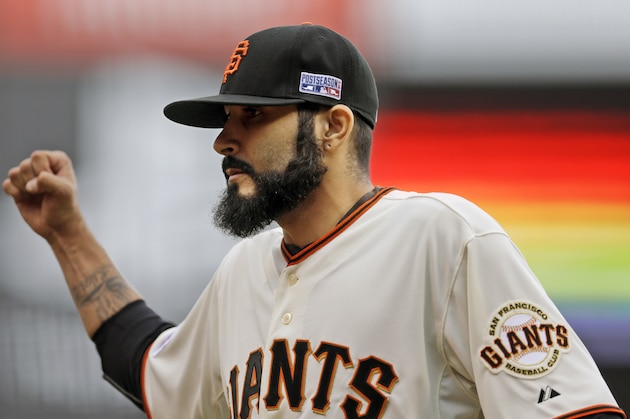 San Francisco Giants relief pitcher Sergio Romo celebrates the end of the the top of the 10th inning of Game 3 of the National League baseball championship series against the St. Louis Cardinals, Tuesday, Oct. 14, 2014, in San Francisco. (AP Photo/Jeff Roberson)