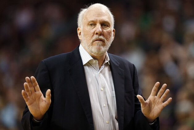 San Antonio Spurs head coach Gregg Popovich against the Boston Celtics during the second half of an NBA basketball game in Boston Sunday, Nov. 30, 2014. (AP Photo/Winslow Townson)