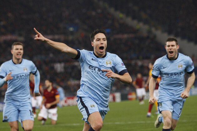 Manchester City's Samir Nasri celebrates after scoring during a Group E Champions League soccer match between Roma and Manchester City at the Olympic stadium in Rome, Italy, Wednesday Dec.10, 2014. (AP Photo/Riccardo De Luca)