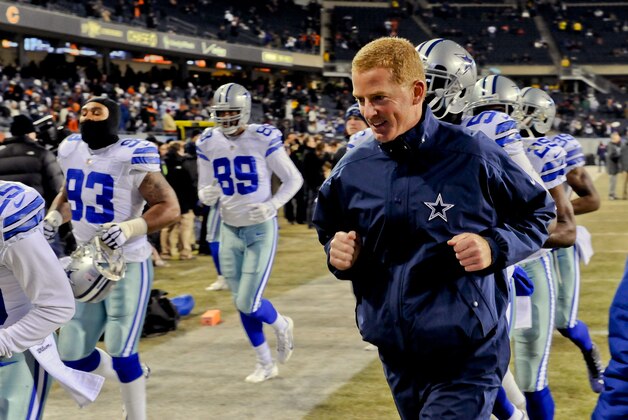 Dec 4, 2014; Chicago, IL, USA; Dallas Cowboys head coach Jason Garrett runs with players before their game against the Chicago Bears at Soldier Field. Mandatory Credit: Matt Marton-USA TODAY Sports