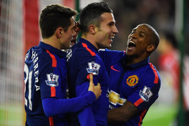 SOUTHAMPTON, ENGLAND - DECEMBER 08:  Robin van Persie of Manchester United celebrates scoring his second goal with Ashley Young (R) and Ander Herrera during the Barclays Premier League match between Southampton and Manchester United at St Mary's Stadium on December 8, 2014 in Southampton, England.  (Photo by Mike Hewitt/Getty Images)