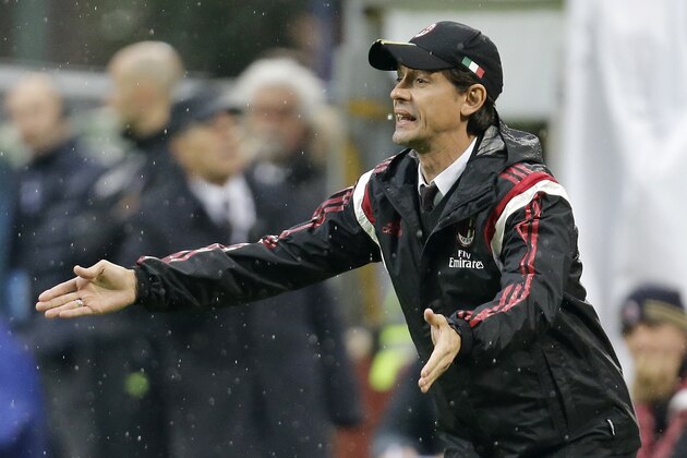 AC Milan coach Filippo Inzaghi gives instructions to his players during the Serie A soccer match between AC Milan and Udinese at the San Siro stadium in Milan, Italy, Sunday, Nov. 30, 2014. (AP Photo/Antonio Calanni)