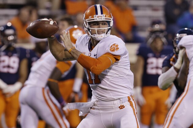 Clemson quarterback Chad Kelly (11) tosses a pass during the second half of an NCAA college football game in Charlottesville, Va., Saturday, Nov. 2, 2013.  Clemson won 59-10.  (AP Photo/Steve Helber)
