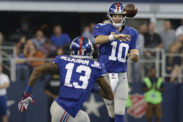 New York Giants quarterback Eli Manning (10) passes to  wide receiver Odell Beckham (13) during the first half of an NFL football game, Sunday, Oct.  19, 2014, in Arlington, Texas. (AP Photo/LM Otero)