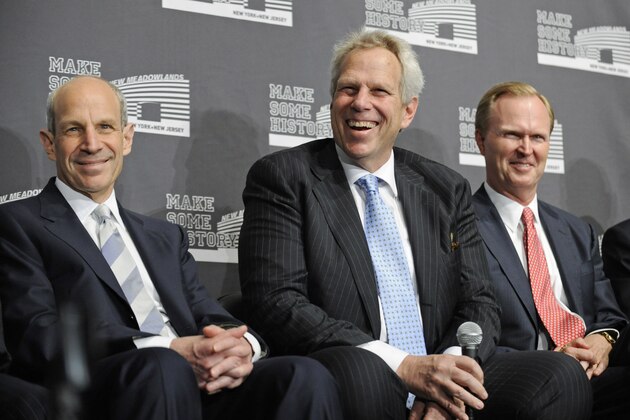 New York giants co-owners Steve Tisch, center, Jonathan Tisch, left, and John Mara smile during a news conference discussing the new Meadowlands football stadium, home of the Giants and the New York Jets, hosting the 2014 NFL Super Bowl, Wednesday, May  26, 2010, in East Rutherford, N.J. (AP Photo/Bill Kostroun)