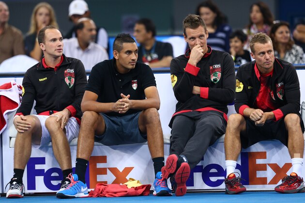 DUBAI, UNITED ARAB EMIRATES - DECEMBER 11:  Bruno Soares,Nick Kyrgios,Tomas Berdych and Lleyton Hewitt of the Singapore Slammers sit on the team bench during their match against the Indian Aces during the Coca-Cola International Premier Tennis League fourth leg at the Hamdan Sports Complex, December 10, 2014 in Dubai.  (Photo by Clive Brunskill/Getty Images for IPTL 2014)