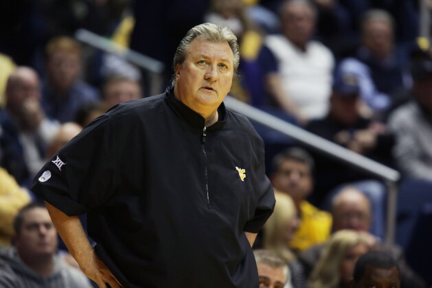 West Virginia coach Bob Huggins watches his players during an NCAA college basketball game, Thursday, Dec. 4, 2014, in Morgantown, W.Va. (AP Photo/Raymond Thompson)