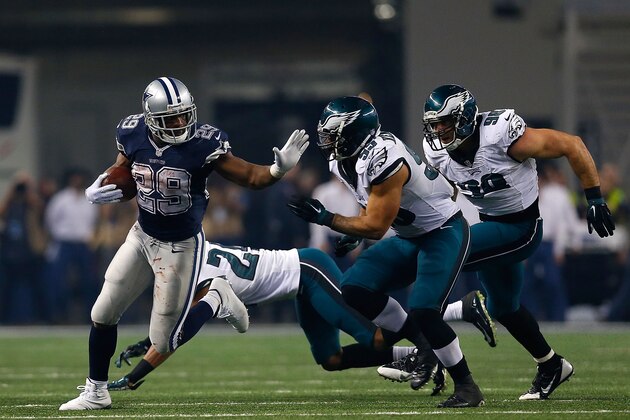 ARLINGTON, TX - NOVEMBER 27:  DeMarco Murray #29 of the Dallas Cowboys prepares to stiff arm Mychal Kendricks #95 of the Philadelphia Eagles as Bradley Fletcher #24 of the Philadelphia Eagles and Connor Barwin #98 of the Philadelphia Eagles are near in the second half at AT&T Stadium on November 27, 2014 in Arlington, Texas.  (Photo by Tom Pennington/Getty Images)