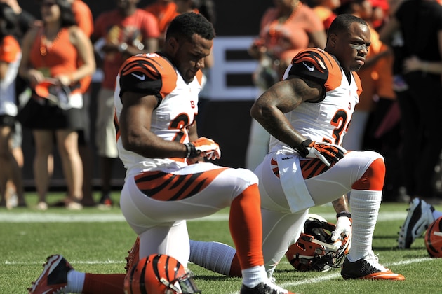 Cincinnati Bengals' Jeremy Hill, right, and Giovani Bernard stretch before their NFL football game against the Tampa Bay Buccaneers Sunday, Nov. 30, 2014 in Tampa, Fla. (AP Photo/Steve Nesius)