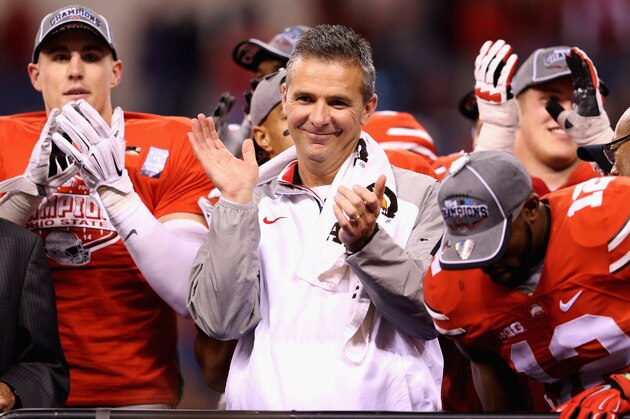 INDIANAPOLIS, IN - DECEMBER 06:  Head coach Urban Meyer of the Ohio State Buckeyes celebrates after his team defeated the Wisconsin Badgers 59-0 in the Big Ten Championship at Lucas Oil Stadium on December 6, 2014 in Indianapolis, Indiana.  (Photo by Andy Lyons/Getty Images)