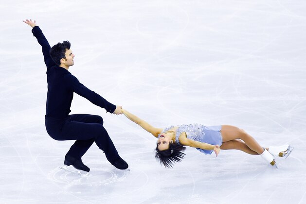 BARCELONA, SPAIN - DECEMBER 11:  Meagan Duhamel and Eric Radford of Canada perform during the Pairs Short Program Final during day one of the ISU Grand Prix of Figure Skating Final 2014/2015 at Barcelona International Convention Centre on December 11, 2014 in Barcelona, Spain.  (Photo by David Ramos/Getty Images)