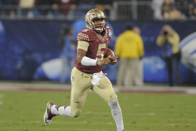 Florida State quarterback Jameis Winston (5) scrambles for a long gain against Georgia Tech during the first half of the Atlantic Coast Conference championship NCAA college football game in Charlotte, N.C., Saturday, Dec. 6, 2014. (AP Photo/Mike McCarn)