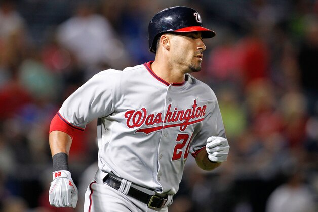 Sep 16, 2014; Atlanta, GA, USA; Washington Nationals shortstop Ian Desmond (20) hits a home run against the Atlanta Braves in the sixth inning at Turner Field. Mandatory Credit: Brett Davis-USA TODAY Sports