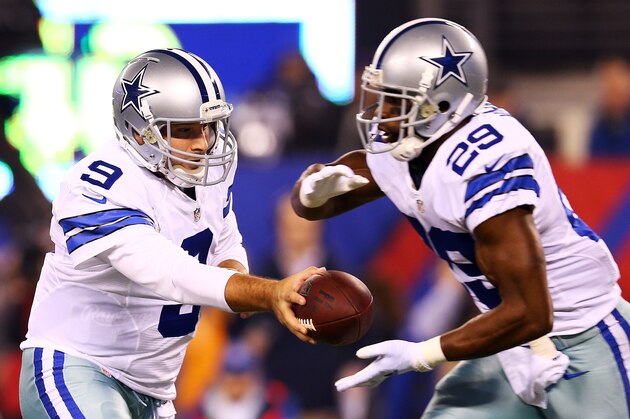 EAST RUTHERFORD, NJ - NOVEMBER 23:   Tony Romo #9 of the Dallas Cowboys hands off to  DeMarco Murray #29 in the first quarter at MetLife Stadium on November 23, 2014 in East Rutherford, New Jersey.  (Photo by Elsa/Getty Images)