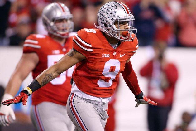Dec 6, 2014; Indianapolis, IN, USA; Ohio State Buckeyes wide receiver Devin Smith (9) celebrates catching a pass in the end zone for a touchdown against the Wisconsin Badgers during the Big Ten football championship game at Lucas Oil Stadium. Mandatory Credit: Brian Spurlock-USA TODAY Sports