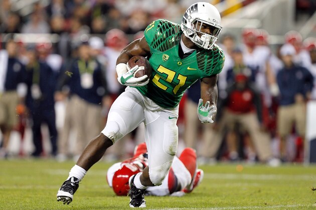 SANTA CLARA, CA - DECEMBER 05: Royce Freeman #21 of the Oregon Ducks keeps on his feet for a gain during the first half against the Arizona Wildcats in the PAC-12 Championships at Levi's Stadium on December 5, 2014 in Santa Clara, California. (Photo by Brian Bahr/Getty Images) SANTA CLARA, CA - DECEMBER 05: Royce Freeman #21 of the Oregon Ducks keeps on his feet for a gain during the first half against the Arizona Wildcats in the PAC-12 Championships at Levi's Stadium on December 5, 2014 in Santa Clara, California. (Photo by Brian Bahr/Getty Images)