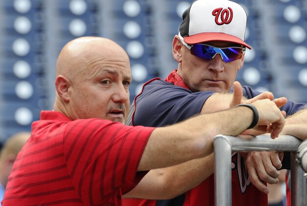 Jul 18, 2014; Washington, DC, USA; Washington Nationals manager Matt Williams talks with general manager Mike Rizzo before the game against the Milwaukee Brewers at Nationals Park. Mandatory Credit: Brad Mills-USA TODAY Sports