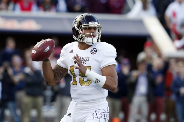 Mississippi State quarterback Dak Prescott (15) prepares to pass against Mississippi during the first half of an NCAA college football game in Oxford, Miss., Saturday, Nov. 29, 2014. No. 18 Mississippi defeated No. 4 Mississippi State, 31-17. (AP Photo/Rogelio V. Solis)