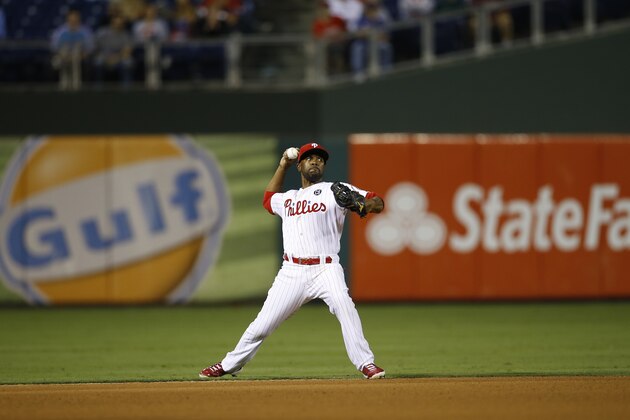 Philadelphia Phillies' Jimmy Rollins throws to first on a grounder during a baseball game against the Pittsburgh Pirates, Monday, Sept. 8, 2014, in Philadelphia. (AP Photo/Matt Slocum)