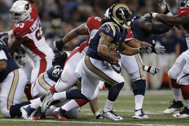 St. Louis Rams running back Tre Mason runs against the Arizona Cardinals during the first half of an NFL football game Thursday, Dec. 11, 2014 in St. Louis. (AP Photo/Jeff Roberson)