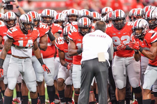 COLUMBUS, OH - SEPTEMBER 6:  Head Coach Urban Meyer of the Ohio State Buckeyes rallies his team before a game against the Virginia Tech Hokies at Ohio Stadium on September 6, 2014 in Columbus, Ohio.  (Photo by Jamie Sabau/Getty Images)