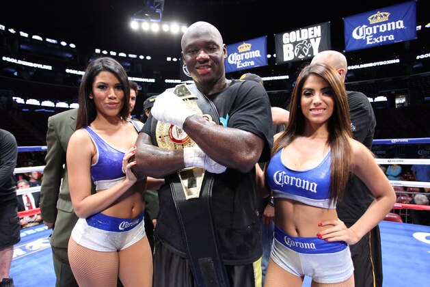 Heavyweight Antonio Tarver celebrates with the Corona Ring Girls after knocking out Mike Sheppard in the 4th round during the