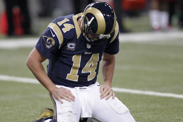 St. Louis Rams quarterback Shaun Hill (14) kneels on the turf during the second half of an NFL football game against the Arizona Cardinals Thursday, Dec. 11, 2014 in St. Louis. (AP Photo/Tom Gannam)