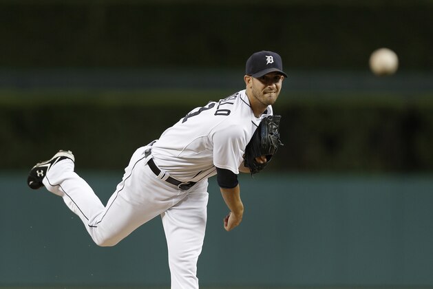Detroit Tigers pitcher Rick Porcello throws a warmup pitch against the New York Yankees in the first inning of a baseball game in Detroit Tuesday, Aug. 26, 2014. (AP Photo/Paul Sancya)