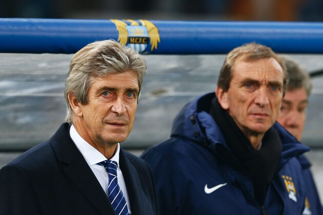 ROME, ITALY - DECEMBER 10:  Manuel Pellegrini manager of Manchester City (L) and assistant Ruben Cousillas look on prior to the UEFA Champions League Group E match between AS Roma and Manchester City FC at Stadio Olimpico on December 10, 2014 in Rome, Italy.  (Photo by Julian Finney/Getty Images)