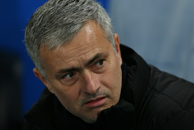 Chelsea Manager José Mourinho looks across the pitch before the Champions League Group G soccer match between Chelsea and Sporting Lisbon at Stamford Bridge in London, Wednesday, Dec. 10, 2014. (AP Photo/Tim Ireland