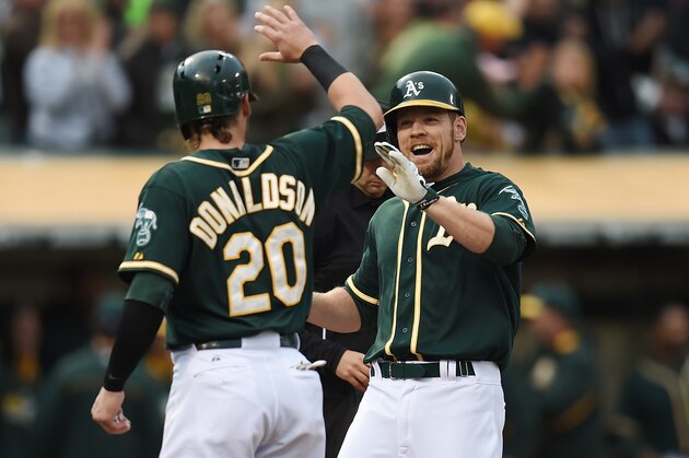 OAKLAND, CA - MAY 30:  Brandon Moss #37 of the Oakand Athletics is congratulated by Josh Donaldson #20 after Moss hit a grand slam home run in the bottom of the first inning against the Los Angeles Angels of Anaheim at O.co Coliseum on May 30, 2014 in Oakland, California.  (Photo by Thearon W. Henderson/Getty Images)