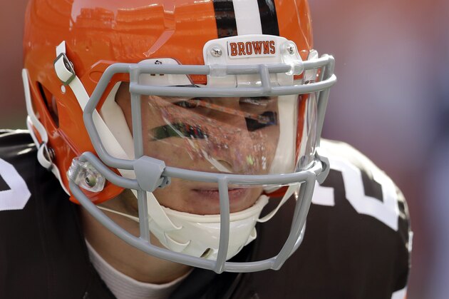Cleveland Browns quarterback Johnny Manziel warms up before an NFL football game against the Indianapolis Colts Sunday, Dec. 7, 2014, in Cleveland. (AP Photo/Tony Dejak)
