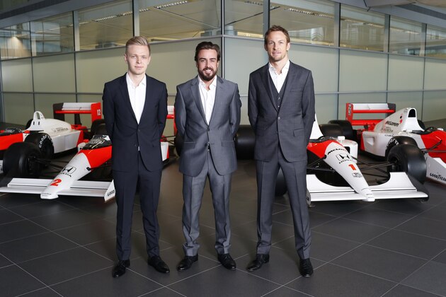 WOKING, ENGLAND- DECEMBER 10: In this handout photo provided by McLaren-Honda, Formula One drivers Fernando Alonso (C) and Jenson Button (R) pose as McLaren-Honda announces its new driver line-up for 2015 with Kevin Magnussen (L) who will remain as test and reserve driver on December 10, 2014 in Woking, England. (Photo by Steven Tee /McLaren-Honda via Getty Images)