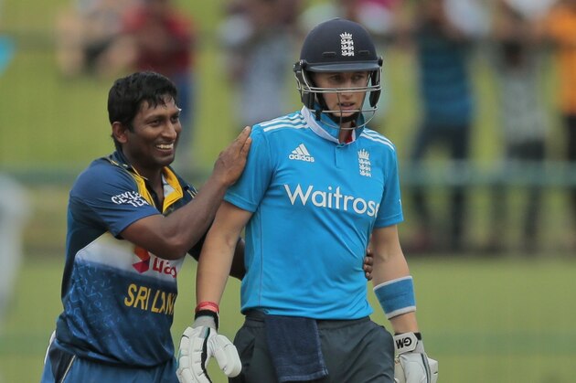 Sri Lankan bowler Jeevan Mendis playfully holds England's batsman Joe Root during the fifth one day international cricket match in Pallekele, Sri Lanka,Thursday, Dec. 11, 2014. (AP Photo/Eranga Jayawardena) Sri Lankan bowler Jeevan Mendis playfully holds England's batsman Joe Root during the fifth one day international cricket match in Pallekele, Sri Lanka,Thursday, Dec. 11, 2014. (AP Photo/Eranga Jayawardena)