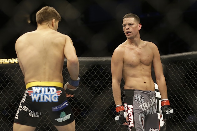 Nate Diaz, right, fights Josh Thomson in a UFC lightweight mixed martial arts fight in San Jose, Calif., Saturday, April 20, 2013. Thomson won by technical knock out in the second round. (AP Photo/Jeff Chiu)