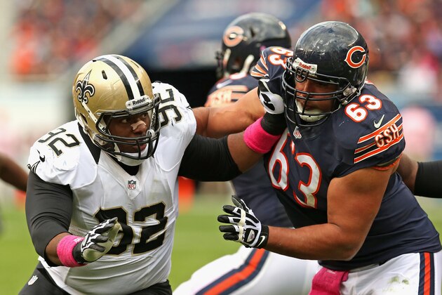 CHICAGO, IL - OCTOBER 06: John Jenkins #92 of the New Orleans Saints rushes against Roberto Garza #63 of the Chicago Bears at Soldier Field on October 6, 2013 in Chicago, Illinois. The Saints defeated the Bears 26-18.  (Photo by Jonathan Daniel/Getty Images)