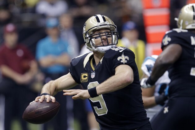 New Orleans Saints quarterback Drew Brees (9) drops back to pass in the first half of an NFL football game against the Carolina Panthers in New Orleans, Sunday, Dec. 7, 2014. (AP Photo/Bill Feig)