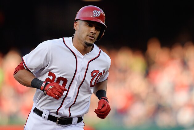 WASHINGTON, DC - JUNE 20:  Ian Desmond #20 of the Washington Nationals rounds third base after hitting a solo home run in the second inning during a game against the Colorado Rockies at Nationals Park on June 20, 2013 in Washington, DC.  (Photo by Patrick McDermott/Getty Images)