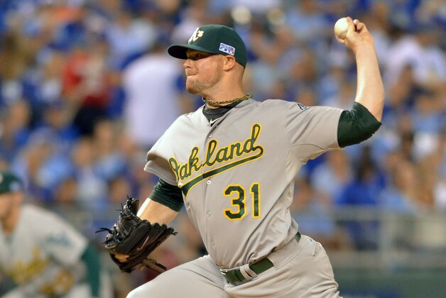 Sep 30, 2014; Kansas City, MO, USA; Oakland Athletics starting pitcher Jon Lester (31) throws a pitch against the Kansas City Royals during the first inning of the 2014 American League Wild Card playoff baseball game at Kauffman Stadium. Mandatory Credit: Denny Medley-USA TODAY Sports