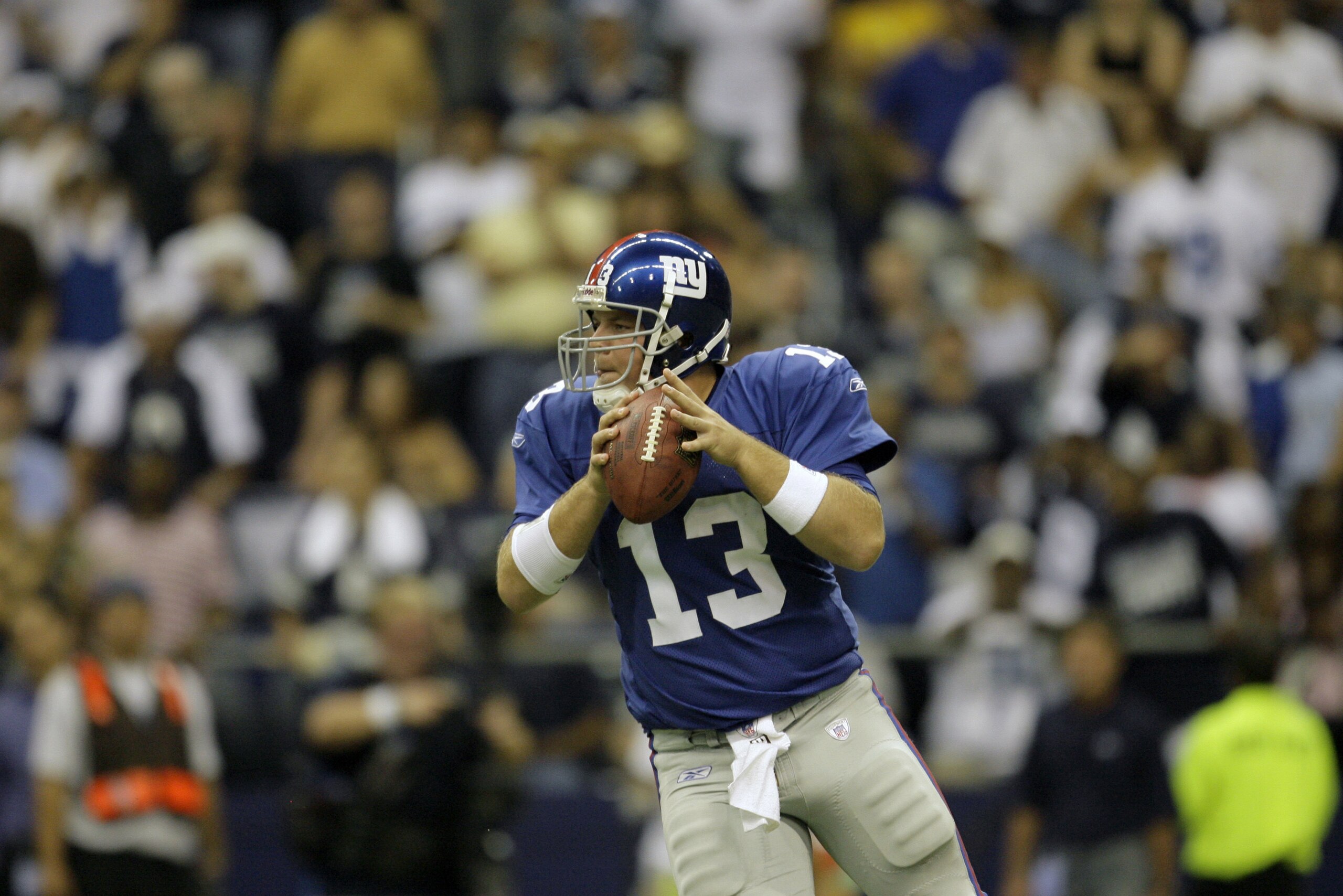New York Giants quarterback Jared Lorenzen (13) looks to pass in the fourth quarter against the Dallas Cowboys in their NFL football game, Sunday, Sept. 9, 2007, in Irving Texas. (AP Photo/Matt Slocum)