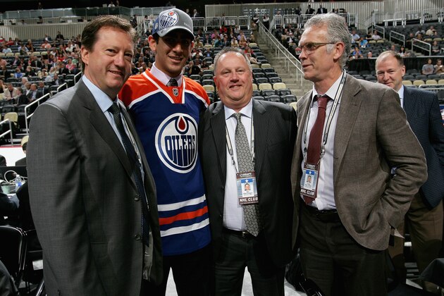 PITTSBURGH, PA - JUNE 23:  (L-R) General manager Steve Tambellini, Jujhar Khaira, drafted 63rd overall by the Edmonton Oilers, amateur scout Stu MacGregor and Senior Vice President of Hockey Operations Craig MacTavish pose during day two of the 2012 NHL Entry Draft at Consol Energy Center on June 23, 2012 in Pittsburgh, Pennsylvania.  (Photo by Dave Sandford/NHLI via Getty Images)